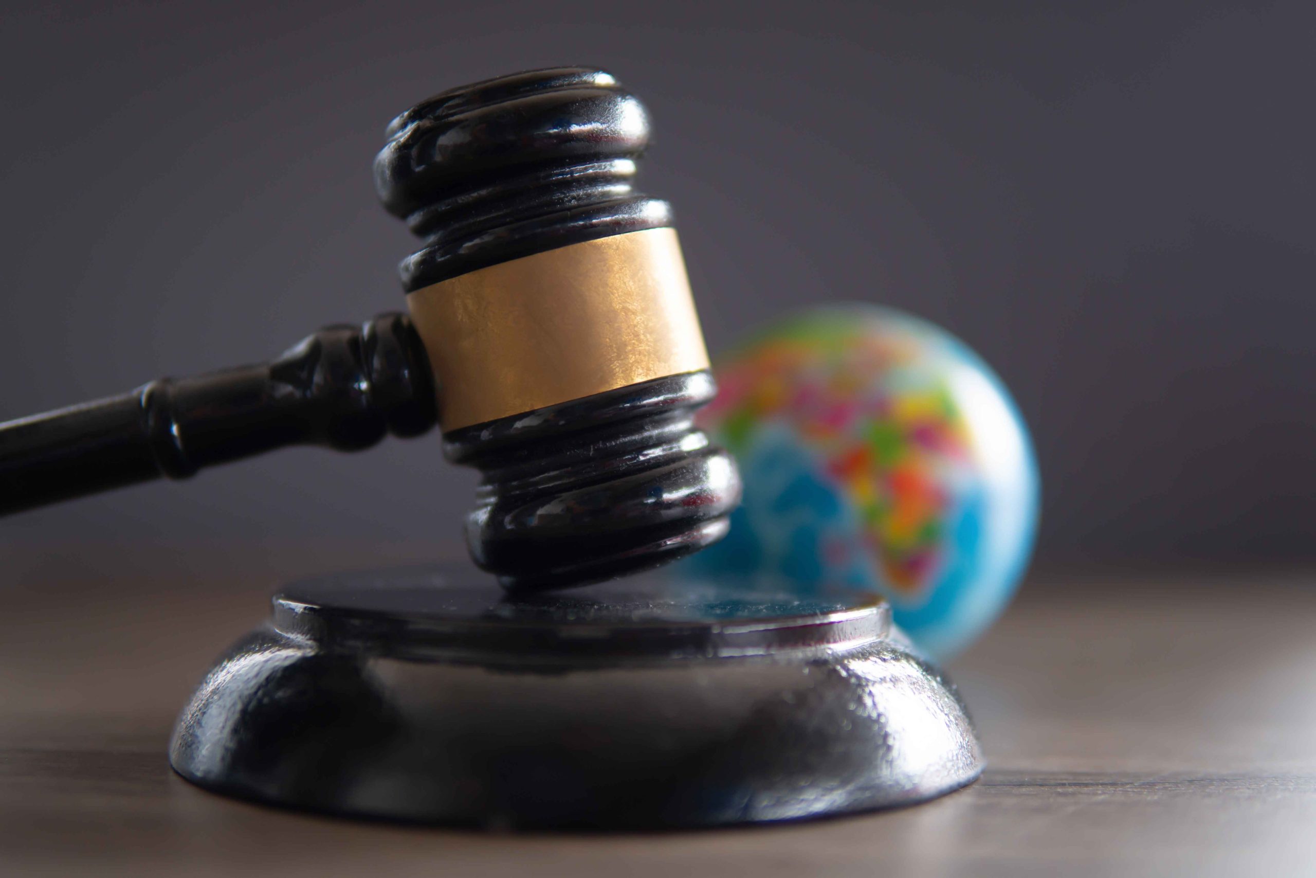 closeup-image-of-judge-gavel-and-world-globe-on-ta-2025-03-14-05-27-31-utc_11zon